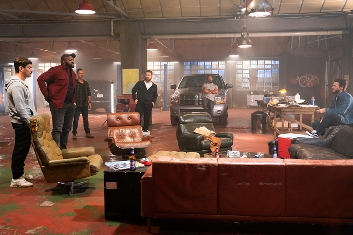 Wrath of Man cast in a garage