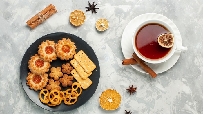 Tea with cookies and cinnamon sticks