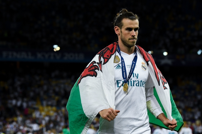 Gareth Bale with Wales flag and Real Madrid medal