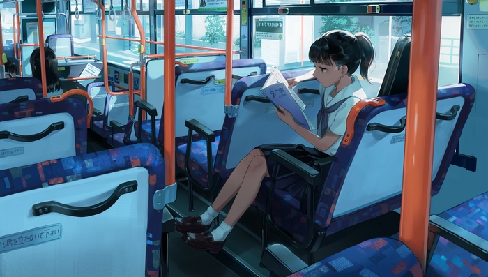 Girl reading on a bus