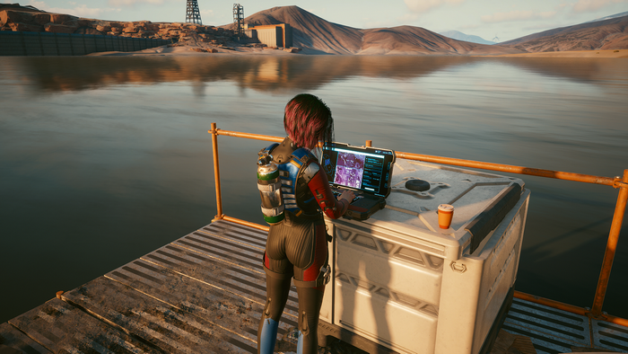 Judy Alvarez from Cyberpunk 2077 using a laptop