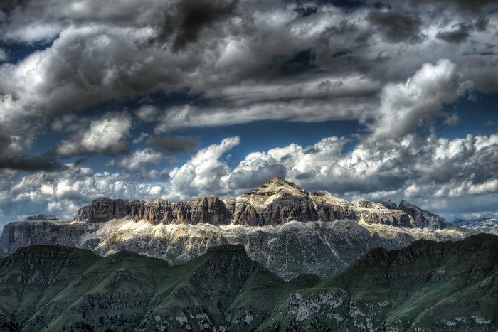 Dramatic mountain range under stormy clouds in Italy