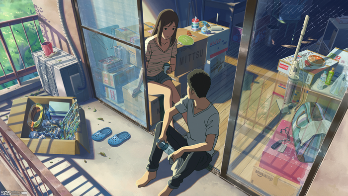 Couple on a balcony with moving boxes