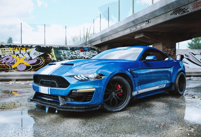 Blue Shelby Mustang with racing stripes on wet asphalt