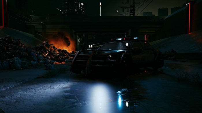 Cyberpunk 2077 police car near burning trash