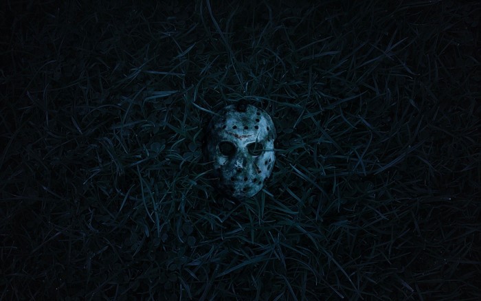 Jason Voorhees mask in grass