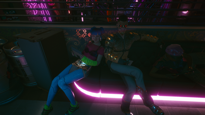 Characters from Cyberpunk 2077 sitting on a couch