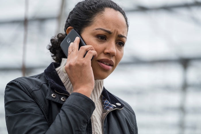 Riann Steele as Finola Jones on the phone