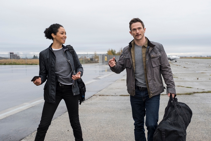 Riann Steele and Jonathan Tucker on the tarmac