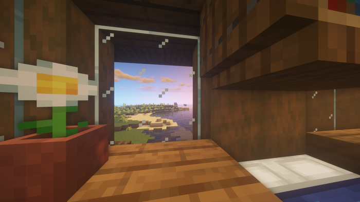 Minecraft interior with a view of a beach at sunset