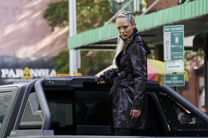 Pom Klementieff in a dark trench coat