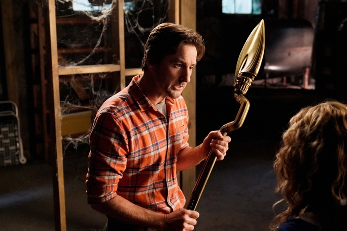 Stargirl Pat Dugan with a golden staff