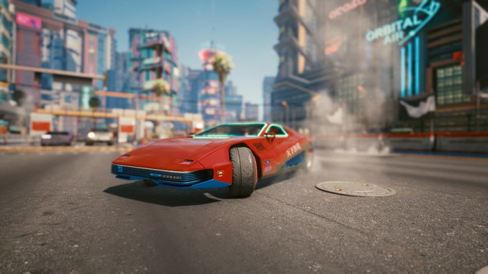 Red sports car in Cyberpunk 2077 city