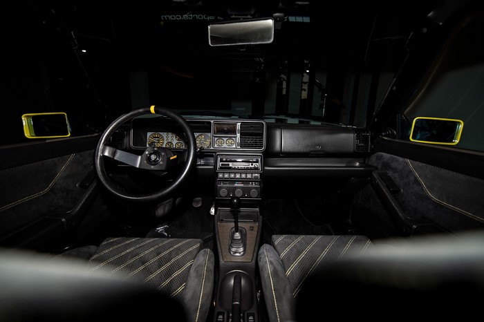 Lancia Delta Integrale interior with yellow accents