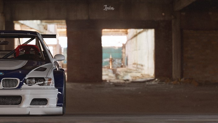 BMW M3 GTR race car in abandoned building