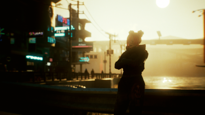 Cyberpunk 2077 character overlooking a futuristic cityscape at sunset