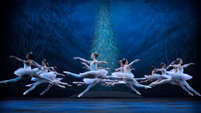 Ballet dancers in white tutus performing on stage
