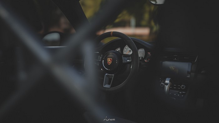 Porsche 911 interior with steering wheel and dashboard