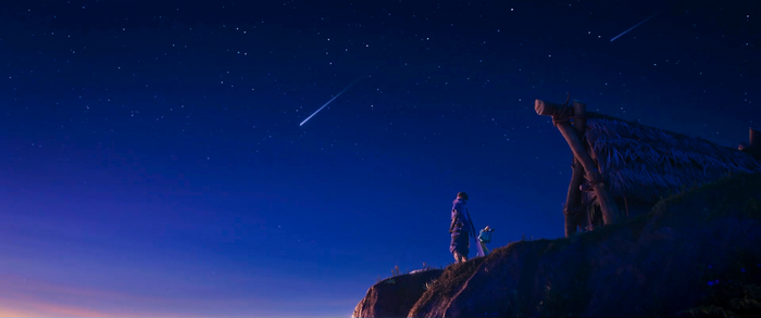 Two figures and a hut on a cliff under a starry sky