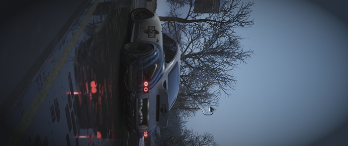Martini Racing car on a wet road at dusk