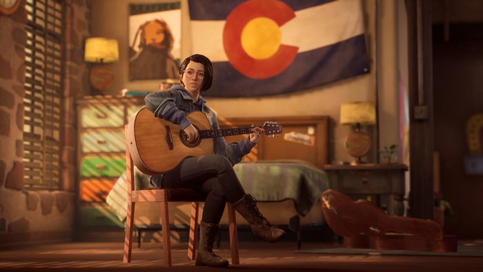 Alex Chen playing guitar in her room