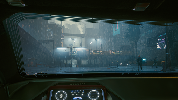 First-person view from a car in Cyberpunk 2077 during rain