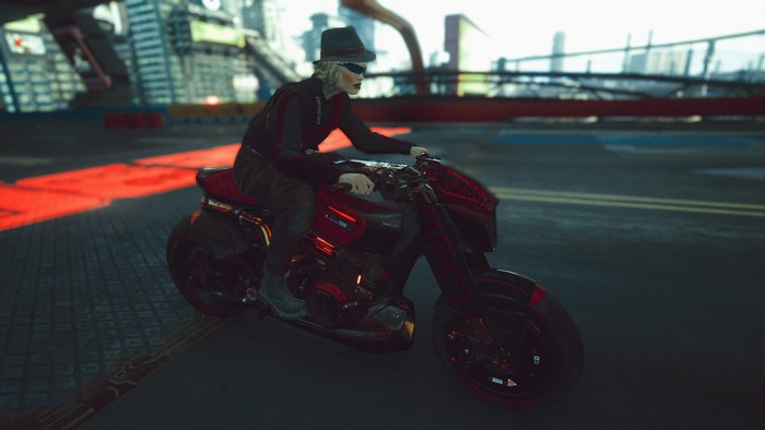 Woman riding a motorcycle in Cyberpunk 2077
