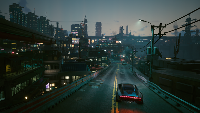 Cyberpunk 2077 screenshot of a futuristic city at dusk