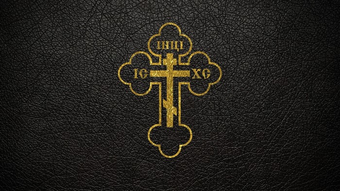 Gold Orthodox Cross on Black Leather Texture