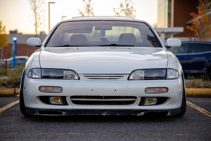 White Nissan 240SX S14 lowered stance