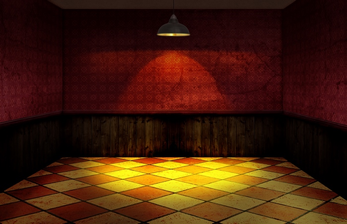 Empty room with checkered floor and hanging lamp