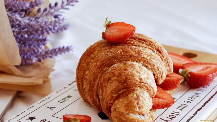 Croissant with strawberries and lavender