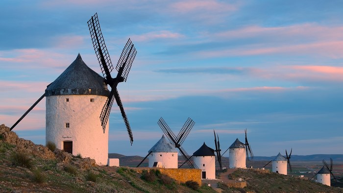 Windmills on a hill at sunset in Toledo, Spain