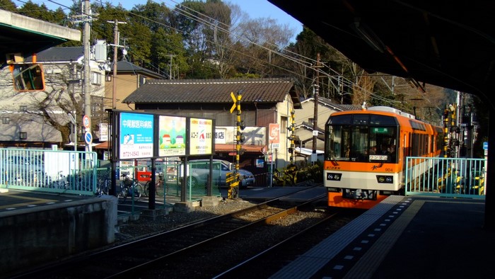 Orange train at a Japanese train station