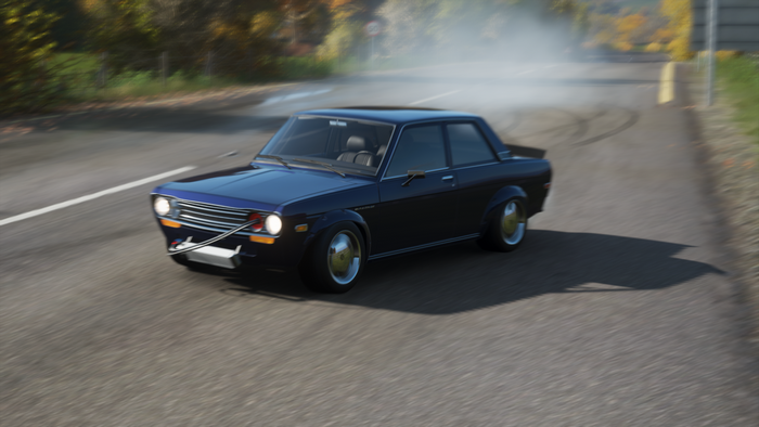 Blue Datsun 510 drifting on a road