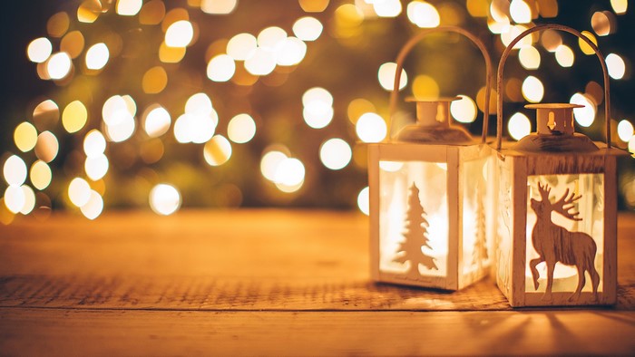 Christmas lanterns with deer and tree silhouettes