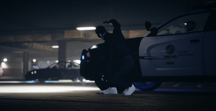 Person in mask near police car in GTA Online