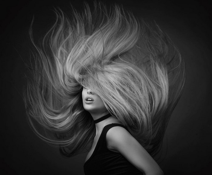 Monochrome portrait of a woman with flowing hair