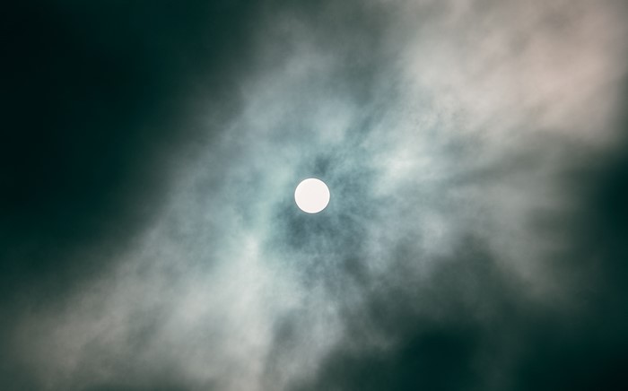 Sun behind clouds