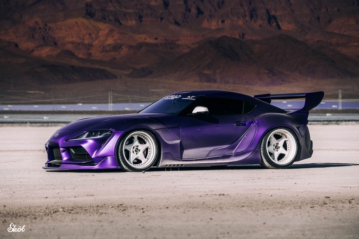 Purple widebody Toyota Supra with large rear wing