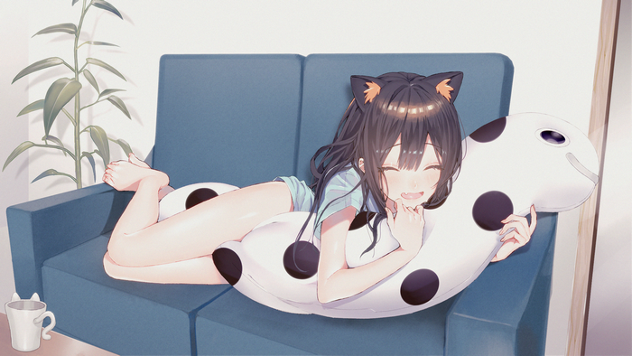 Anime girl with cat ears hugging a pillow on a couch