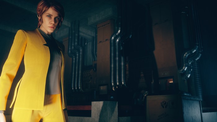 Jesse Faden from Control in a yellow blazer
