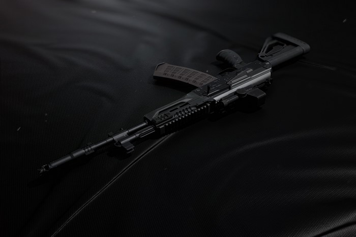 AK-12 assault rifle on a dark surface