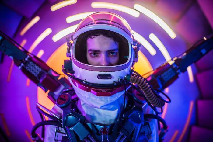 Kodi Smit-McPhee in a futuristic astronaut suit