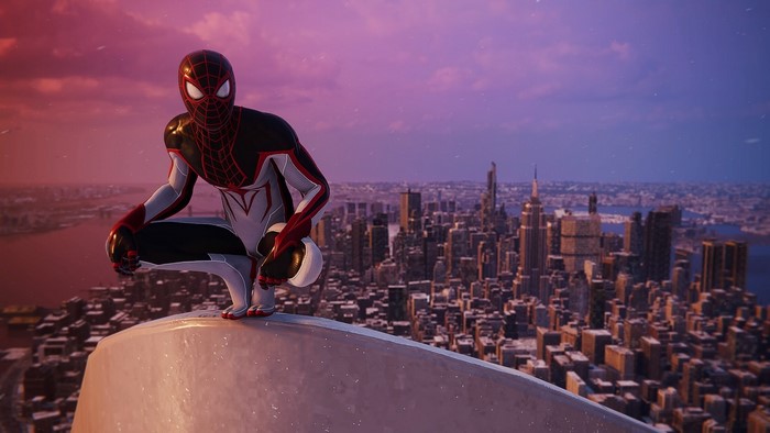 Spider-Man (Miles Morales) crouching on a building overlooking New York City