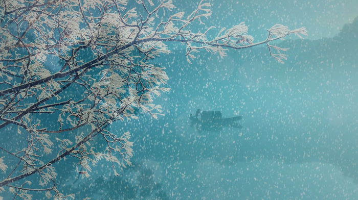 Snowing over a tree branch and a boat