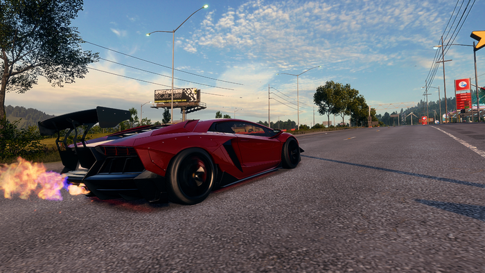 Red Lamborghini Aventador with flames on road