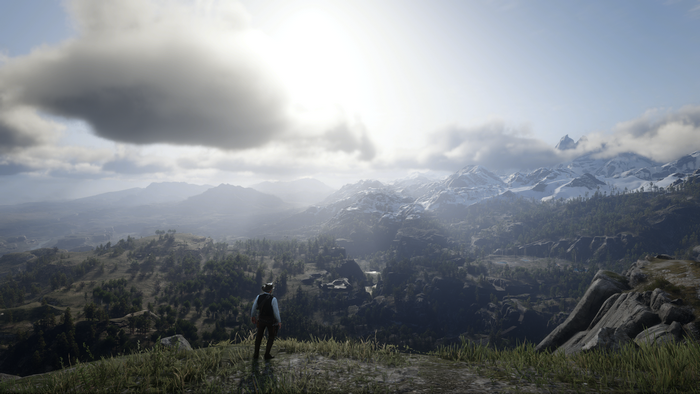 Man overlooking mountains in Red Dead Redemption 2