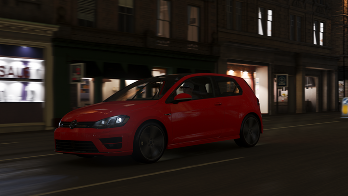 Red Volkswagen Golf R driving at night in Forza Horizon 4