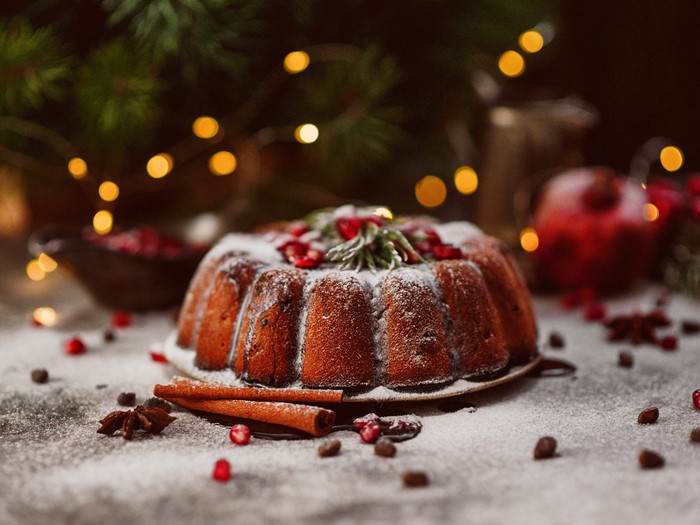 Christmas bundt cake with powdered sugar and pomegranate seeds